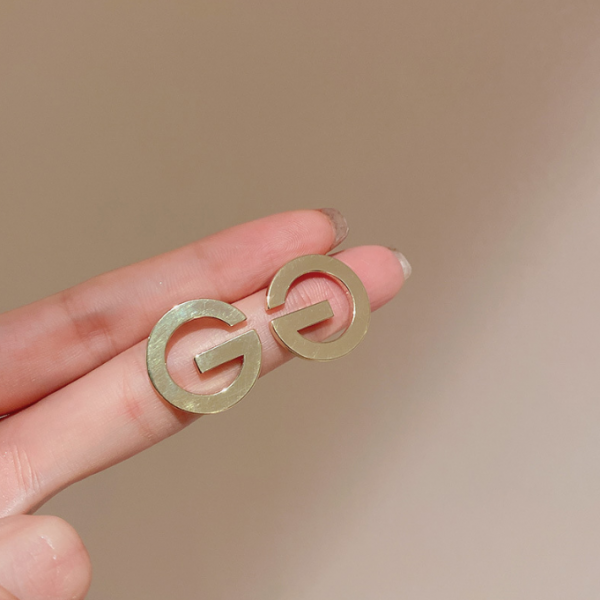 Сережки у формі "G" металеві, золото